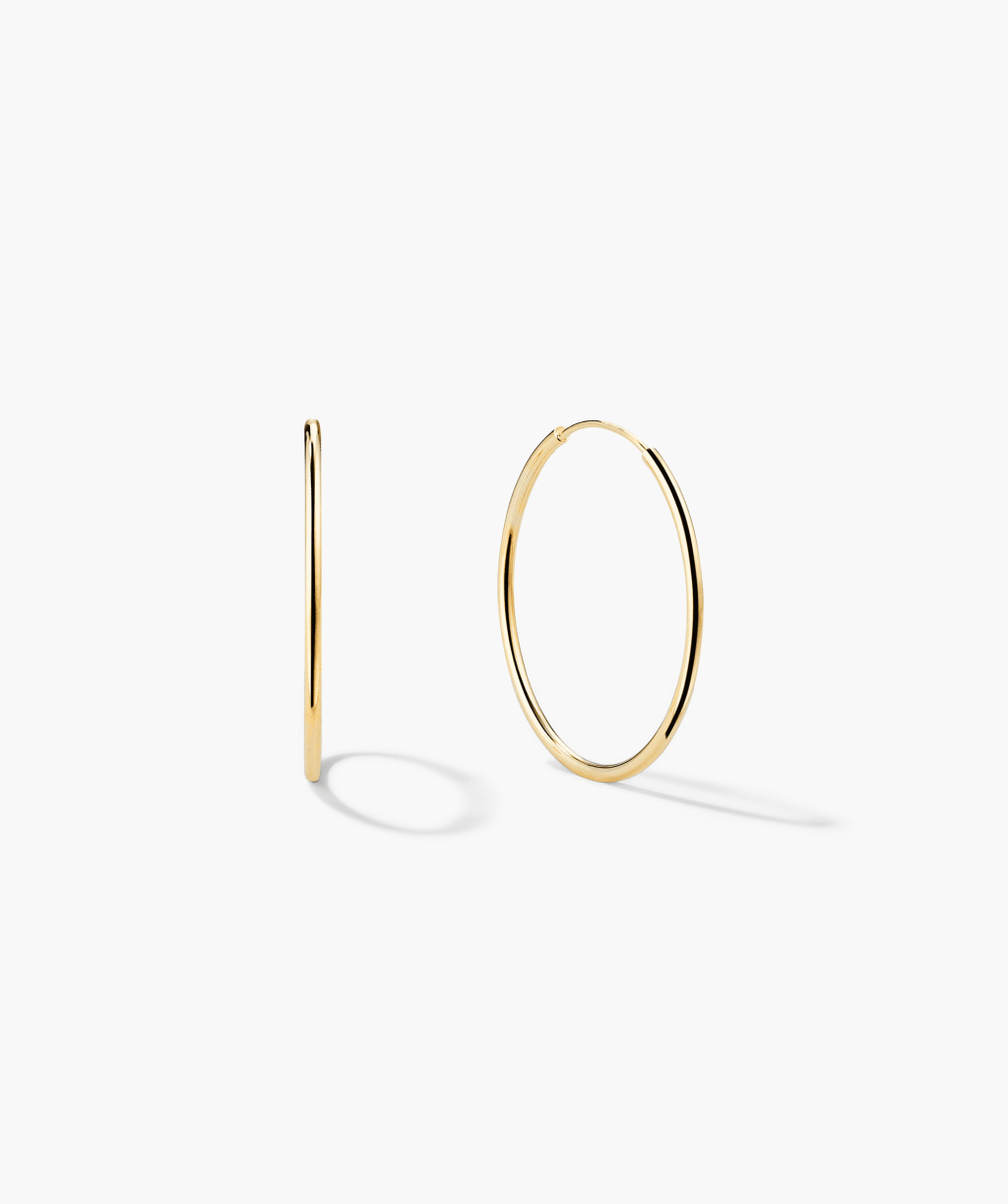 Small gold hoops wake up tied-back hair before highlighter&nbsp;does