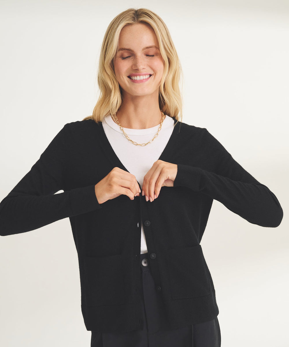 thin cardigan over the shoulders makes a plain tank look intentional 2