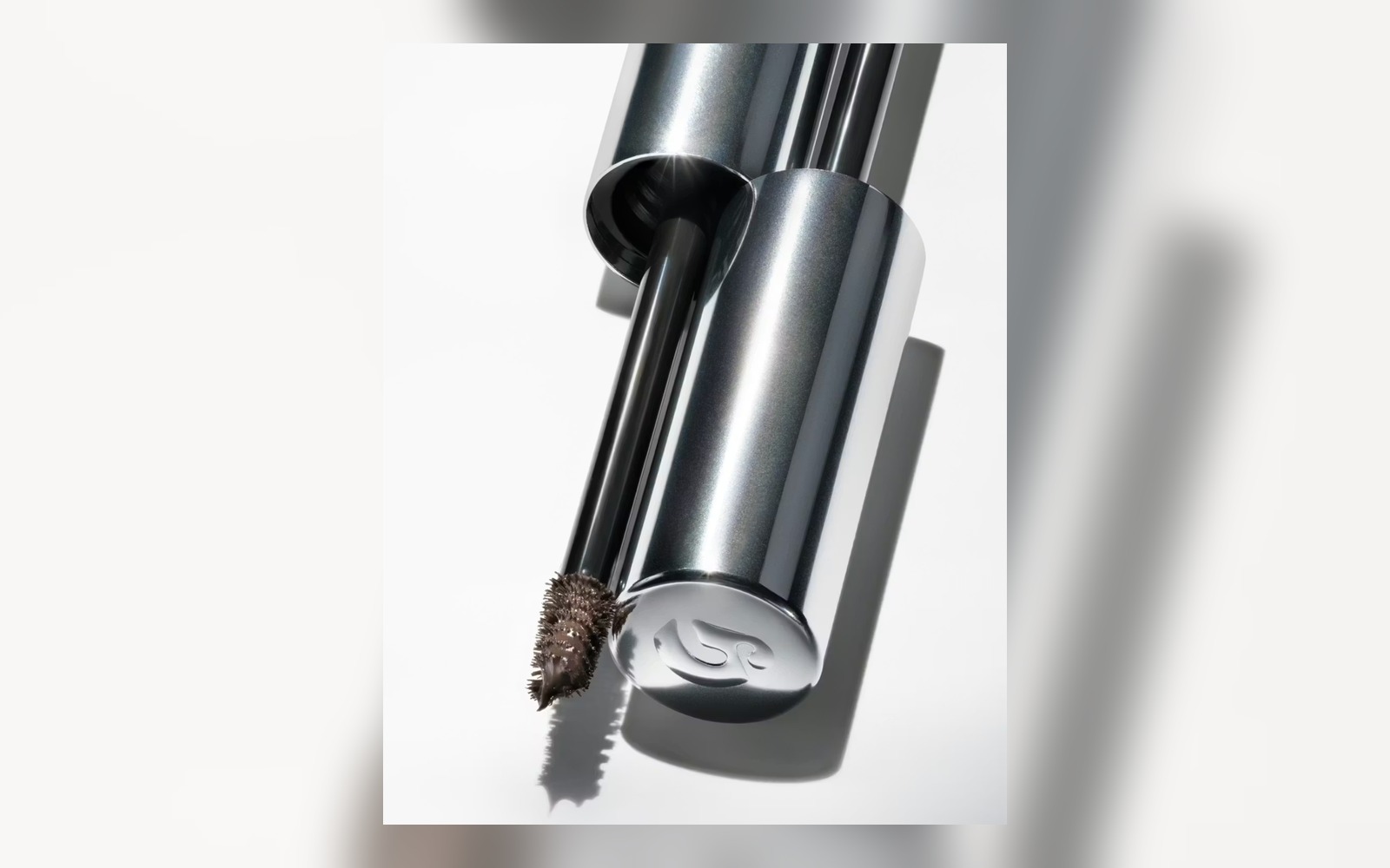 close detail of tinted brow gel brush and product