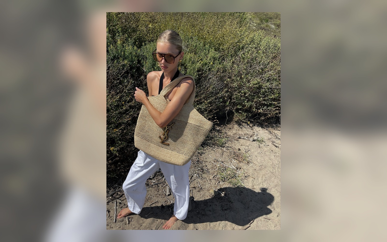 raffia bag styled with a white summer outfit