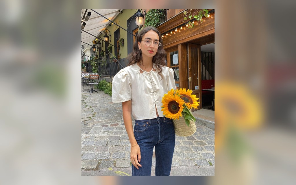 white romantic blouse styled with blue jeans