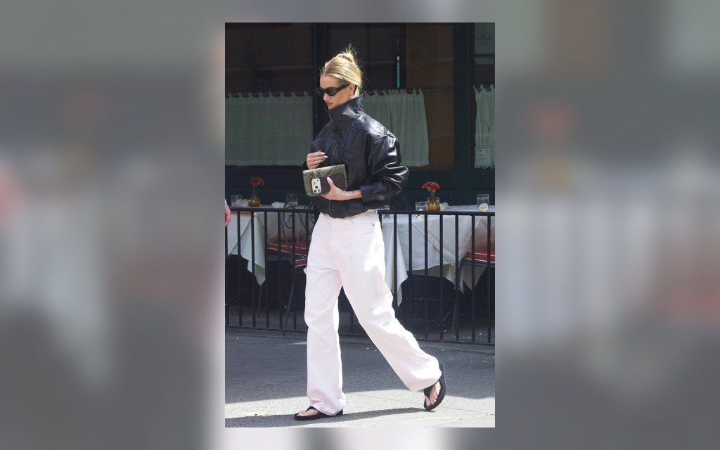 white jeans styled with black sandals