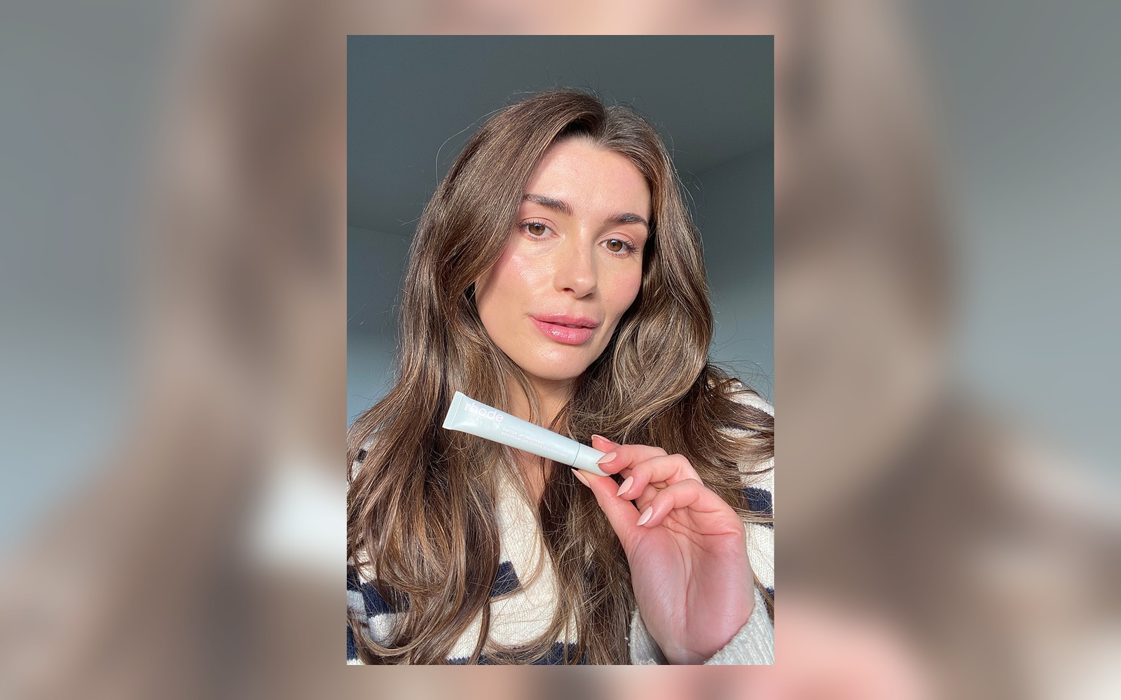 model holding Rhode peptide lip treatment