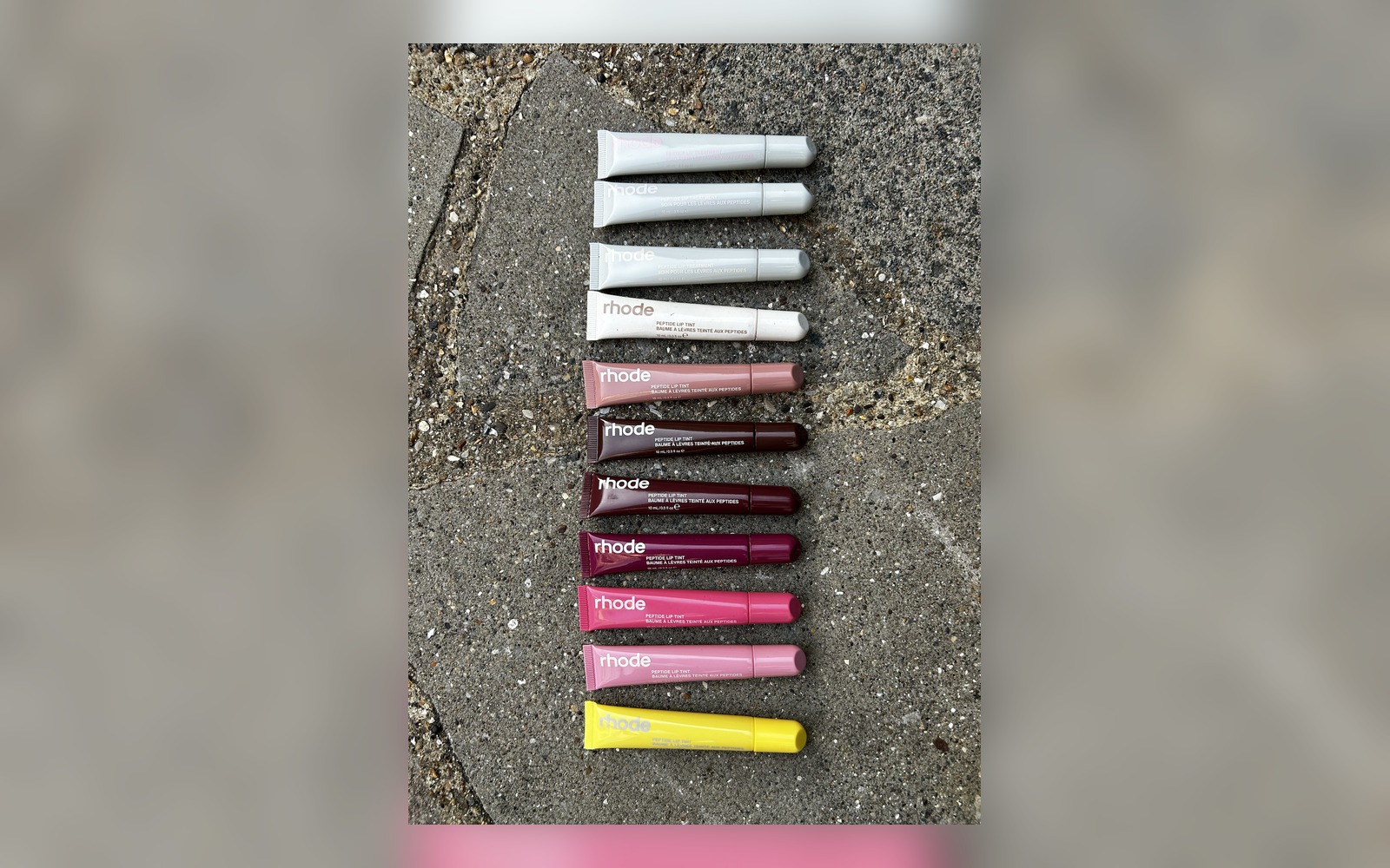 Rhode peptide lip treatment shades laid out together